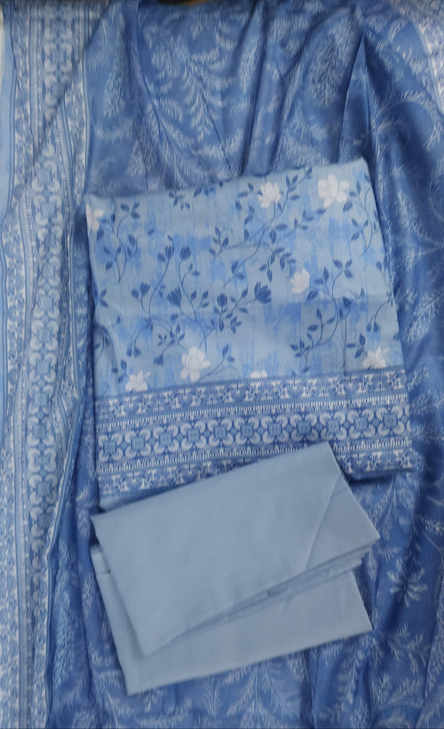 Blue fabric with floral patterns on a white surface