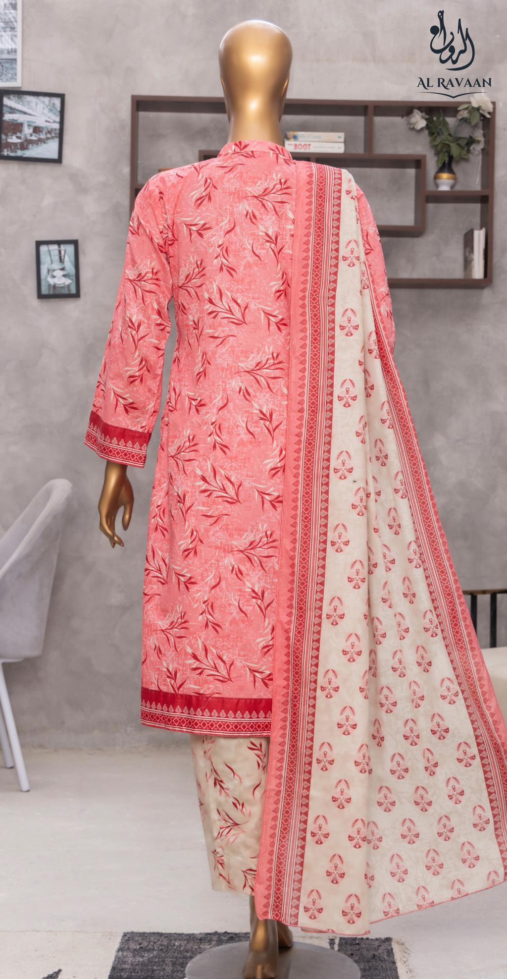 Pink and white embroidered traditional outfit on a mannequin against a neutral background